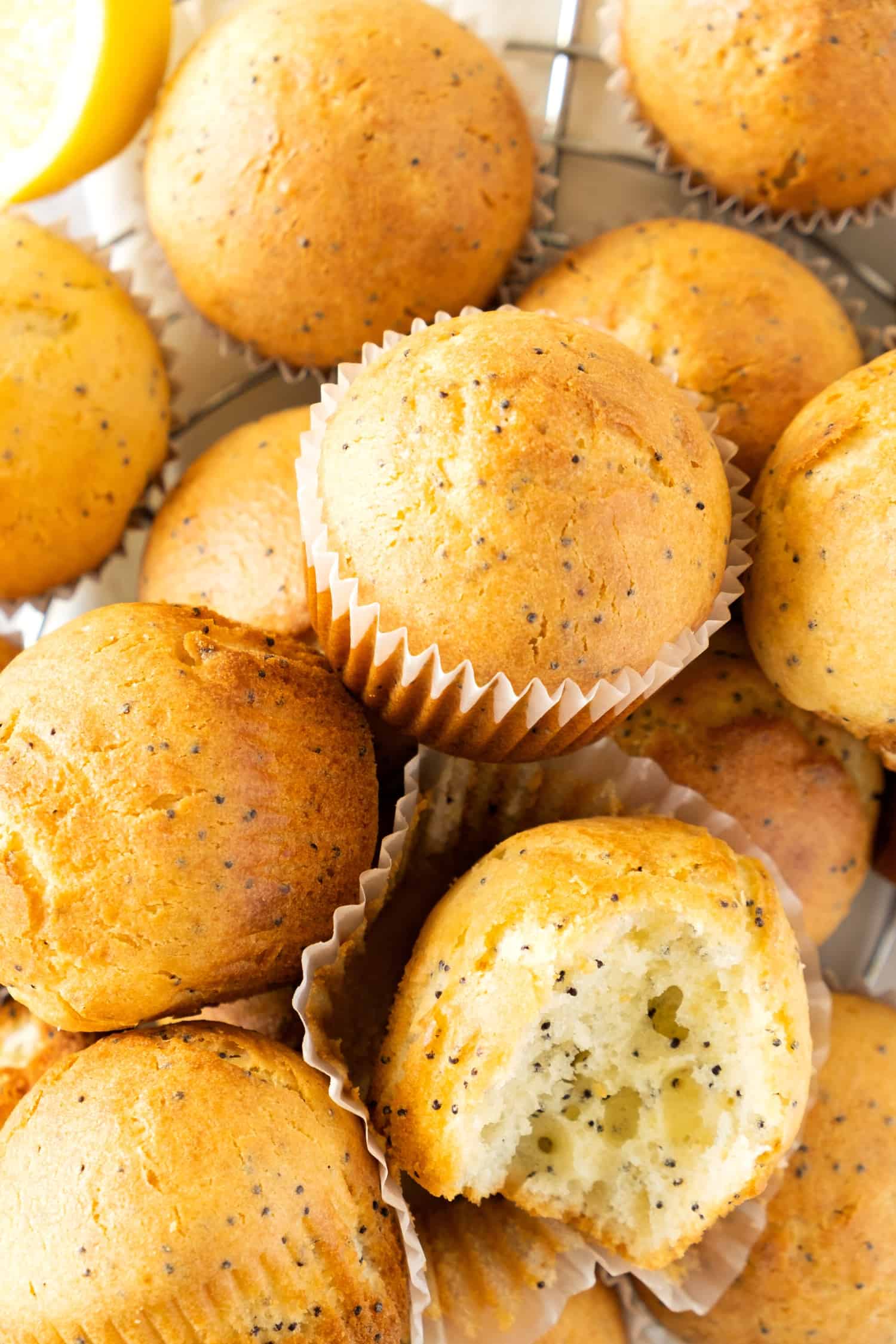 Up close view of many gf lemon poppy seed muffins.