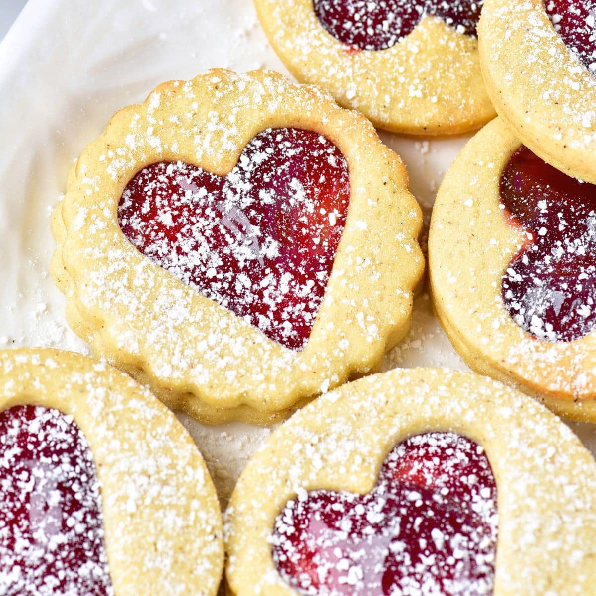 Linzer cookies sprinkled with powdered sugar
