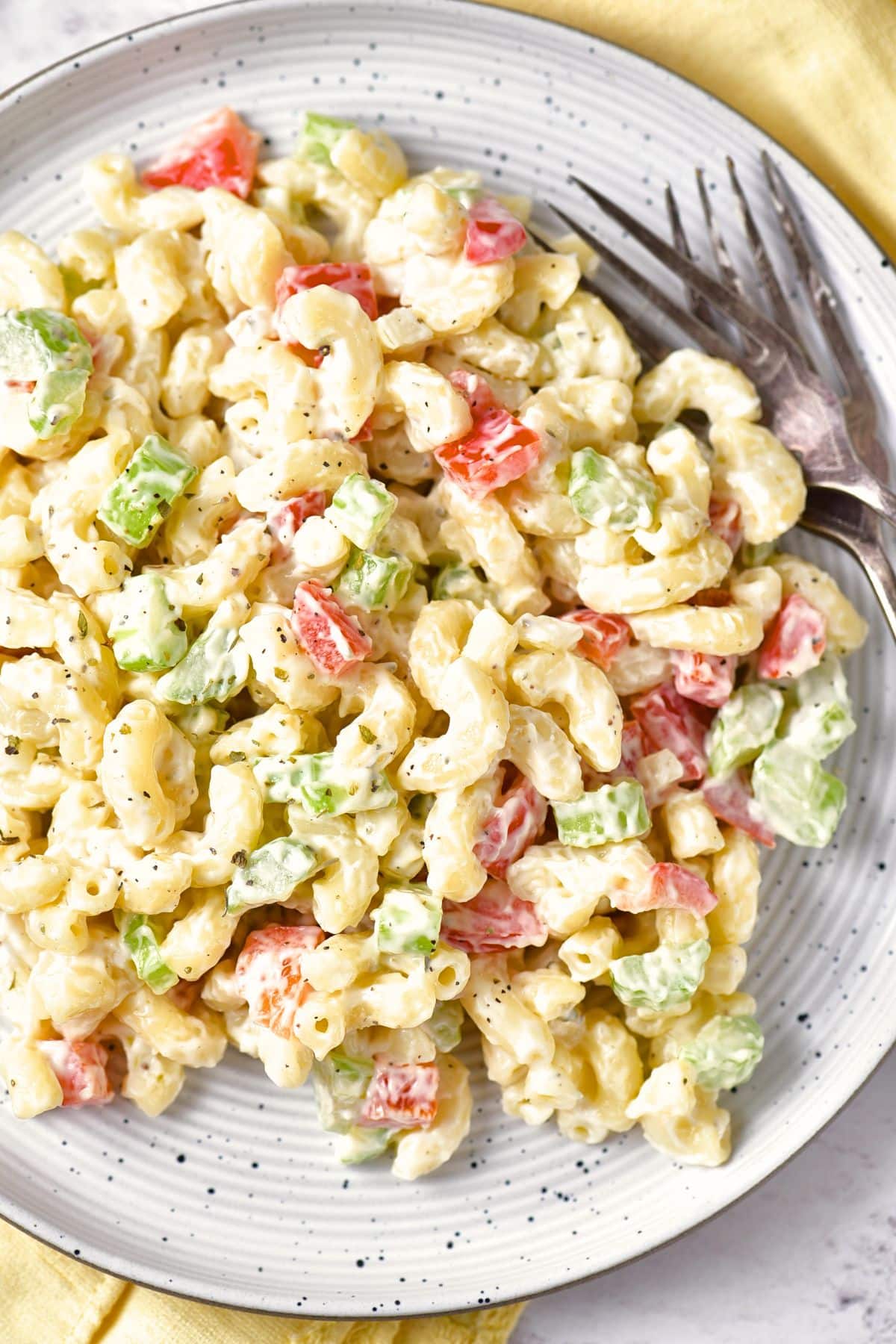 Top down view of a plate of gluten-free macaroni salad.