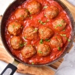 A skillet full of gluten-free meatballs in tomato sauce