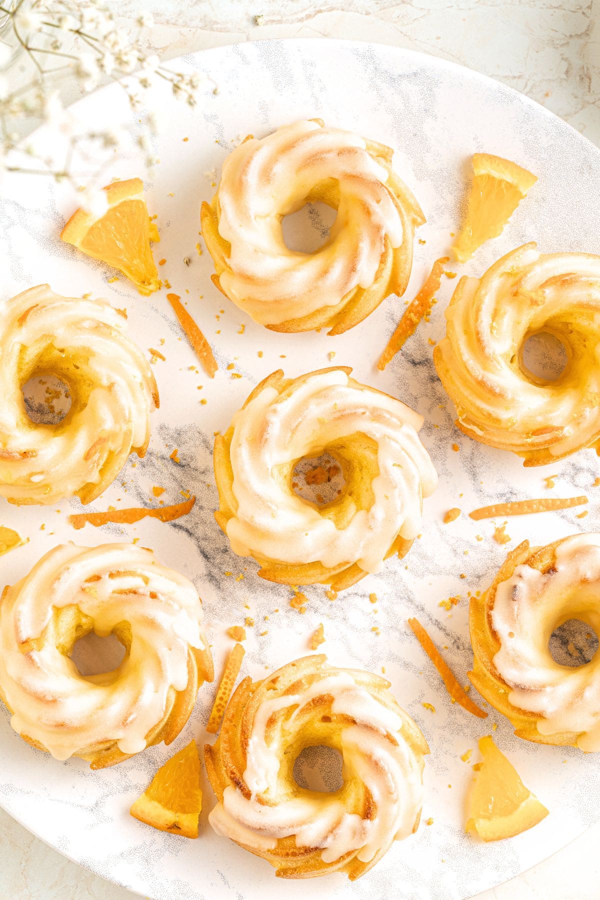 Mini bundt cakes on white plate.