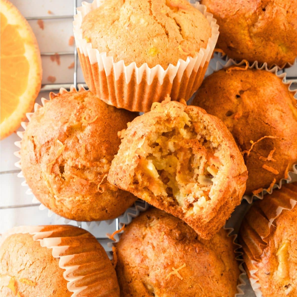 Half-eaten morning glory muffins on wire rack