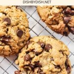 Chocolate chip oatmeal cookies cooling on wire rack.