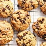Oatmeal chocolate chip cookies cooling on wire rack.