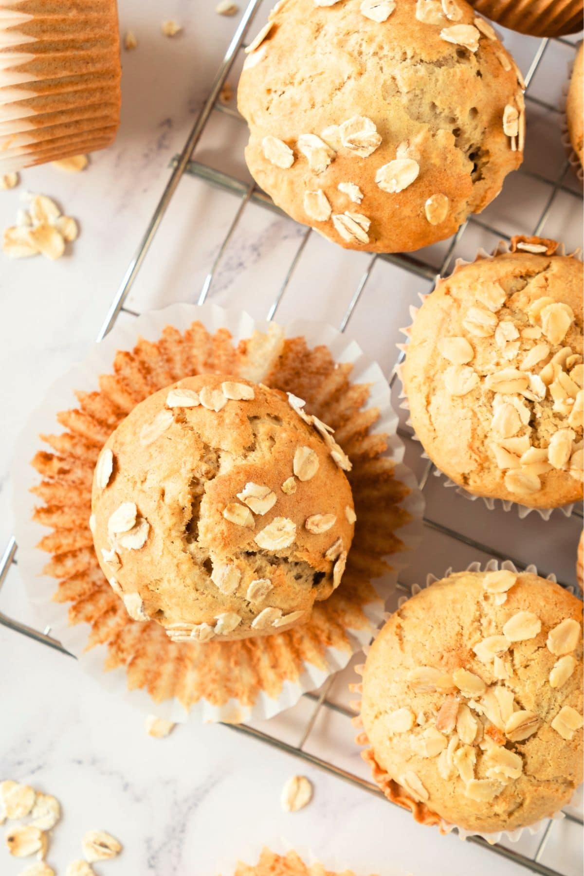 Top down view of oatmeal muffins on wire rack