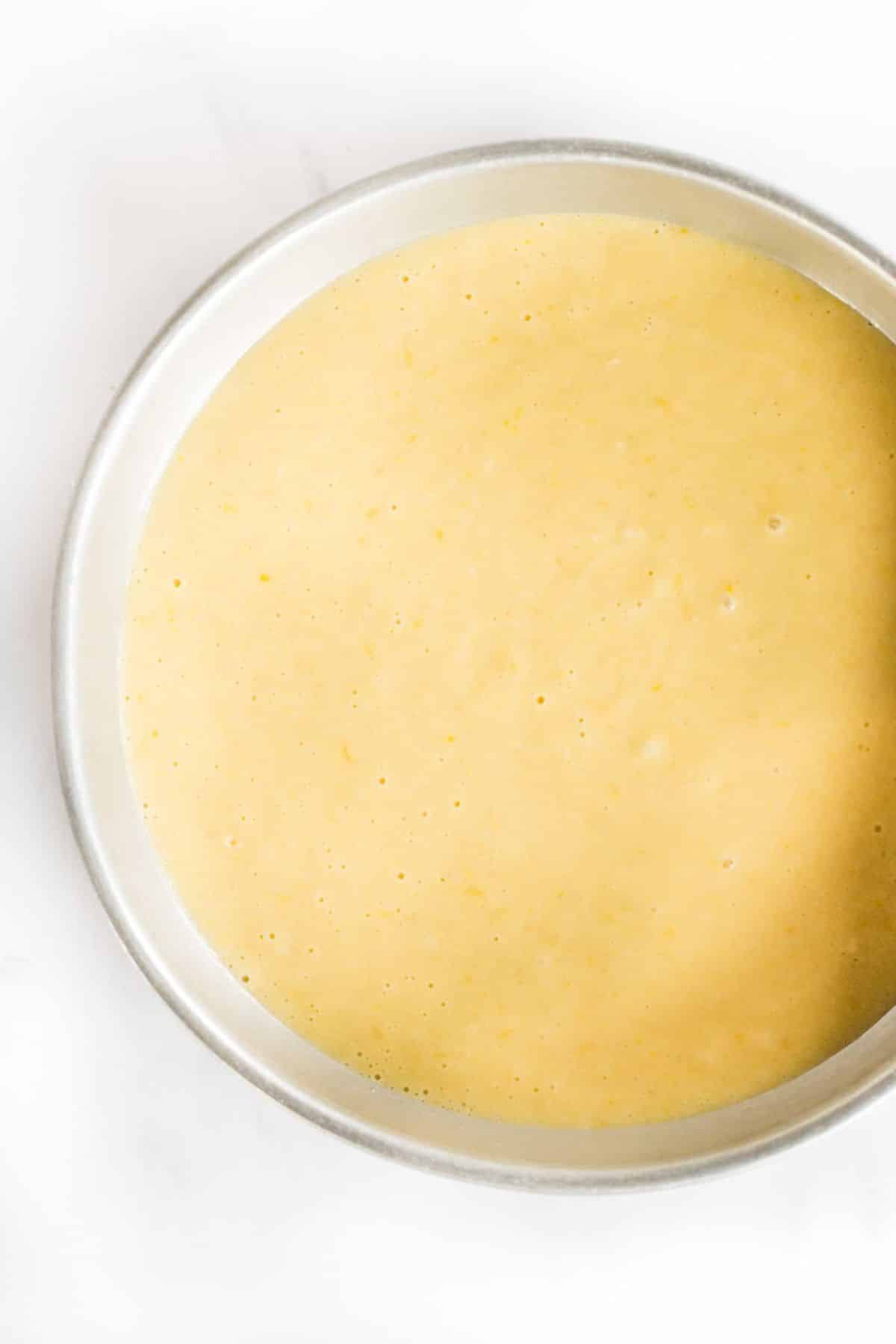 Dairy-Free Olive Oil Cake (Gluten-Free) Olive oil cake batter in metal cake pan.