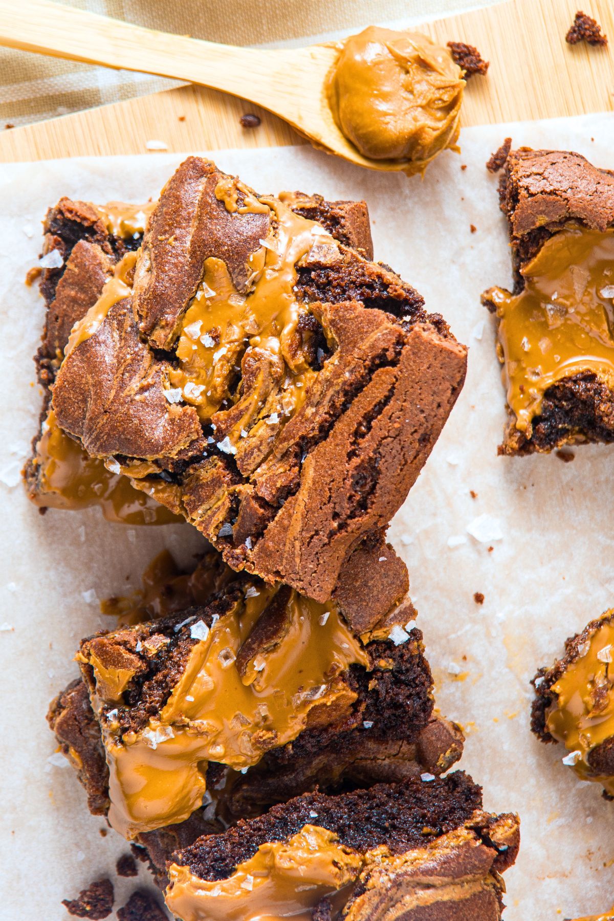 Chocolate peanut butter brownies on parchment paper.