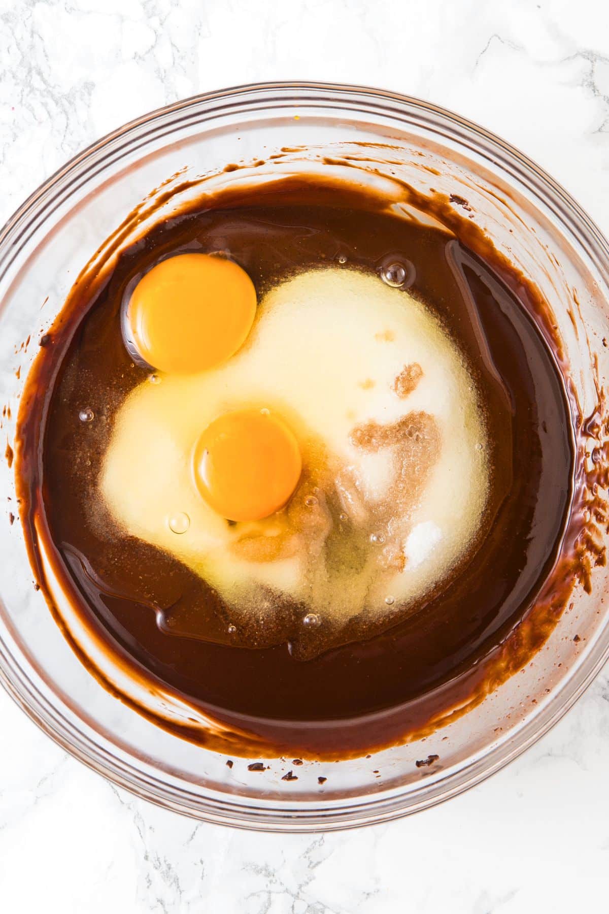 Eggs and sugar in chocolate mixture.