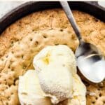 Top down view of ice cream on cookie skillet.