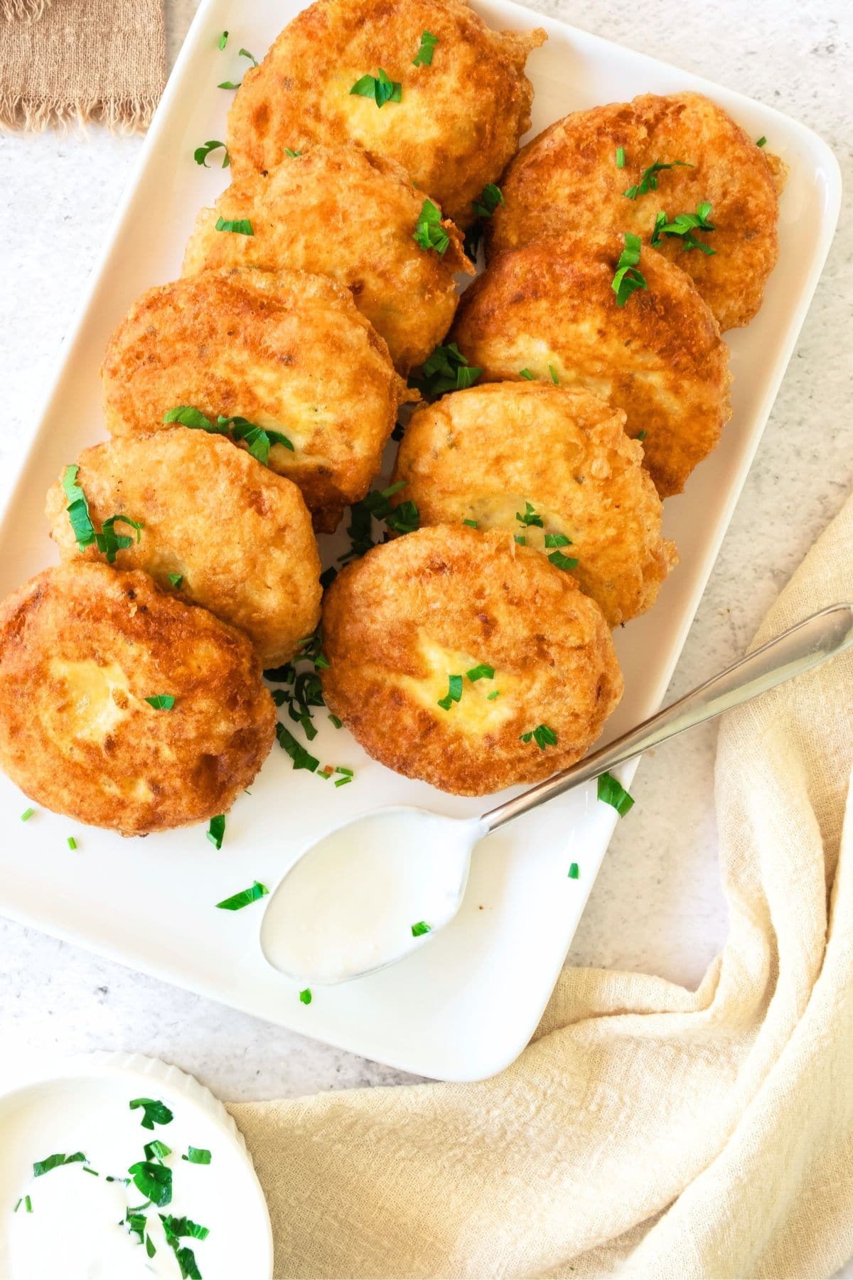 Gluten-free potato patties sprinkled with chopped parsley