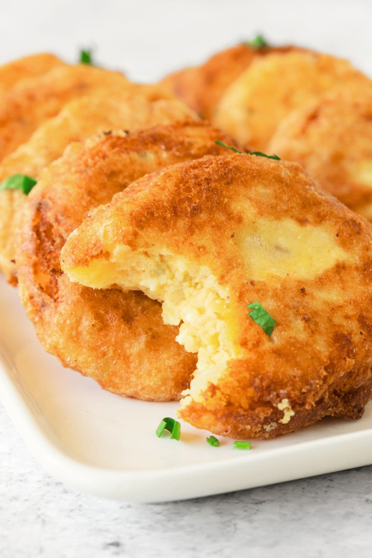 Half-eaten gluten-free potato fritters