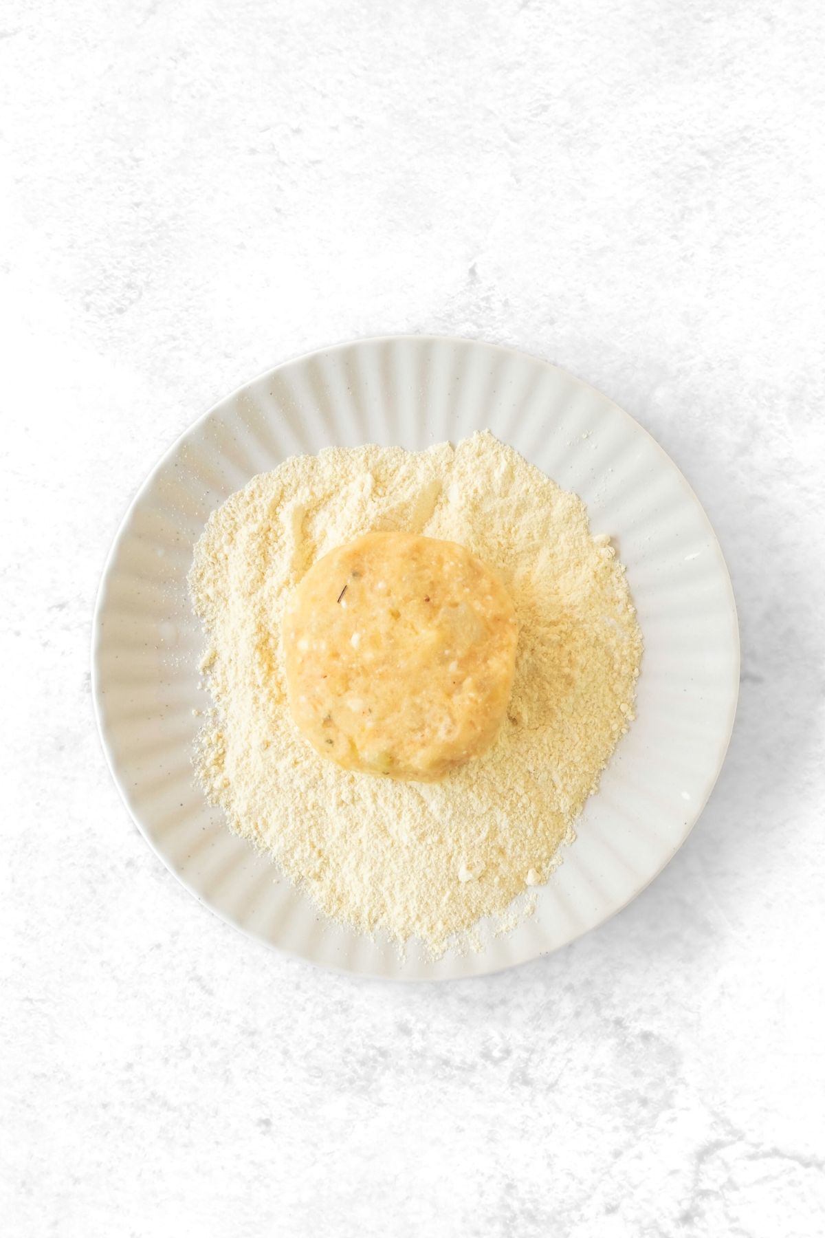 Coating potato patties in cornmeal