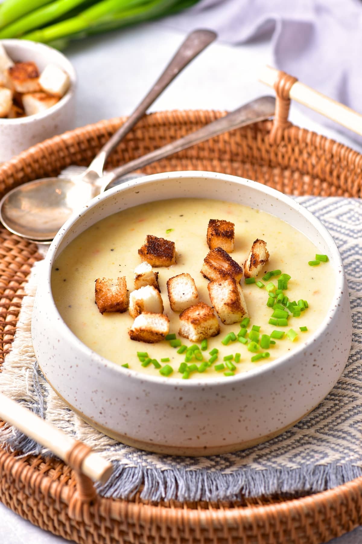 A bowl of gluten-free dairy-free potato soup in a basket.