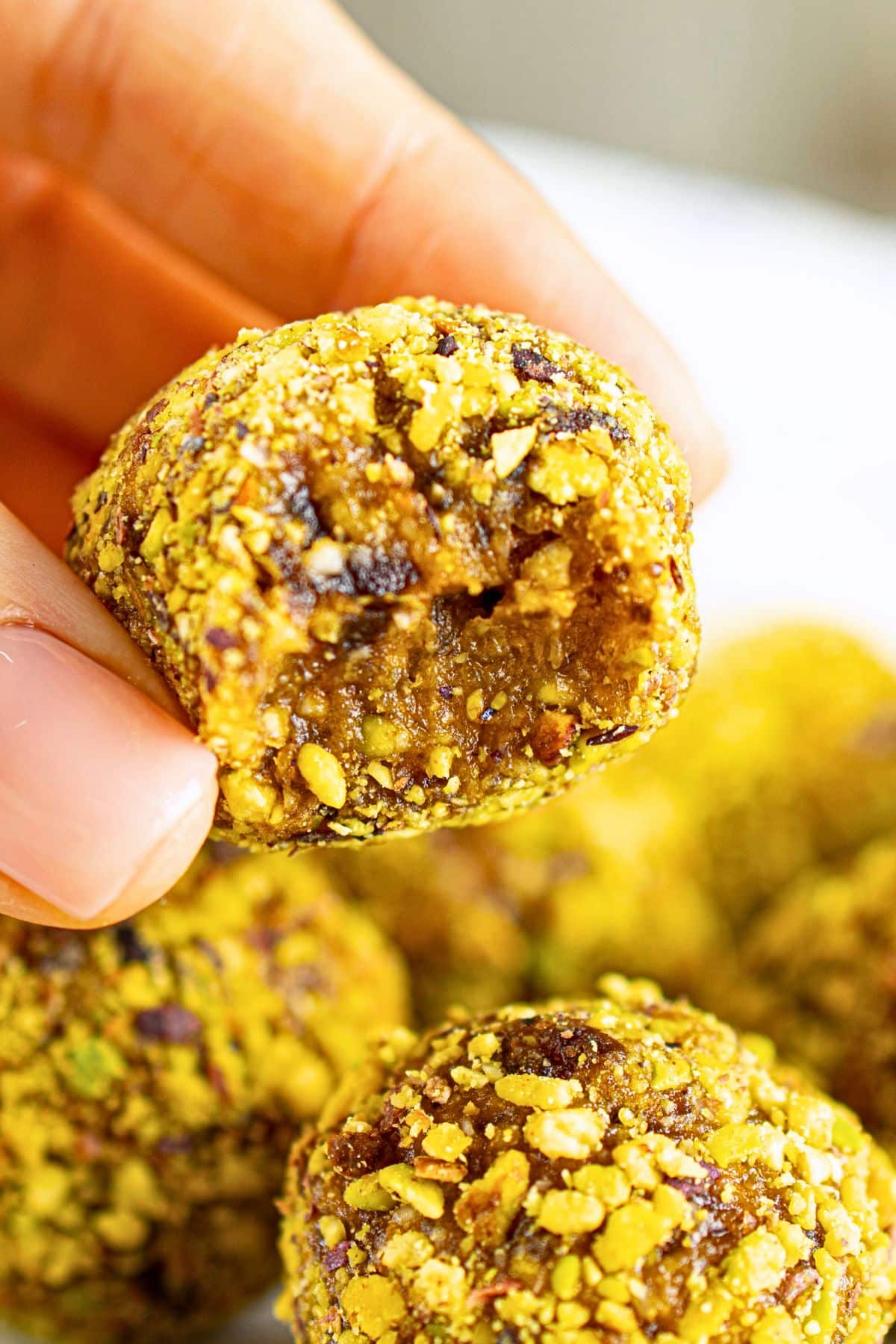 Holding up a half-eaten energy ball.