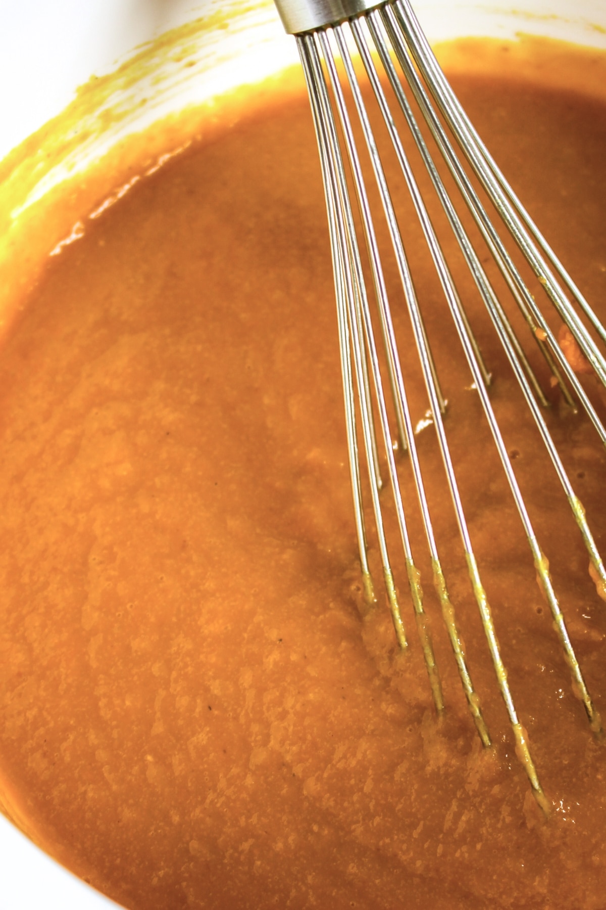 Gluten-Free Pumpkin Coffee Cake (Dairy-Free) Mixing pumpkin mixture in bowl.