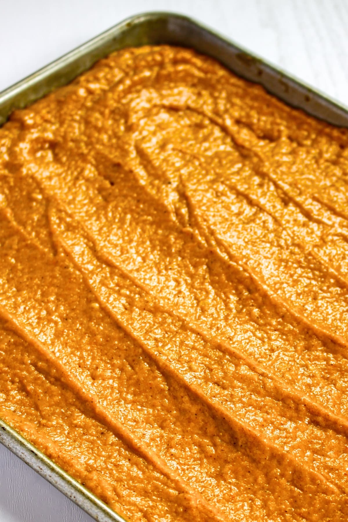 Pumpkin Gluten-Free Cake (Dairy-Free) Pumpkin cake batter in cake pan.