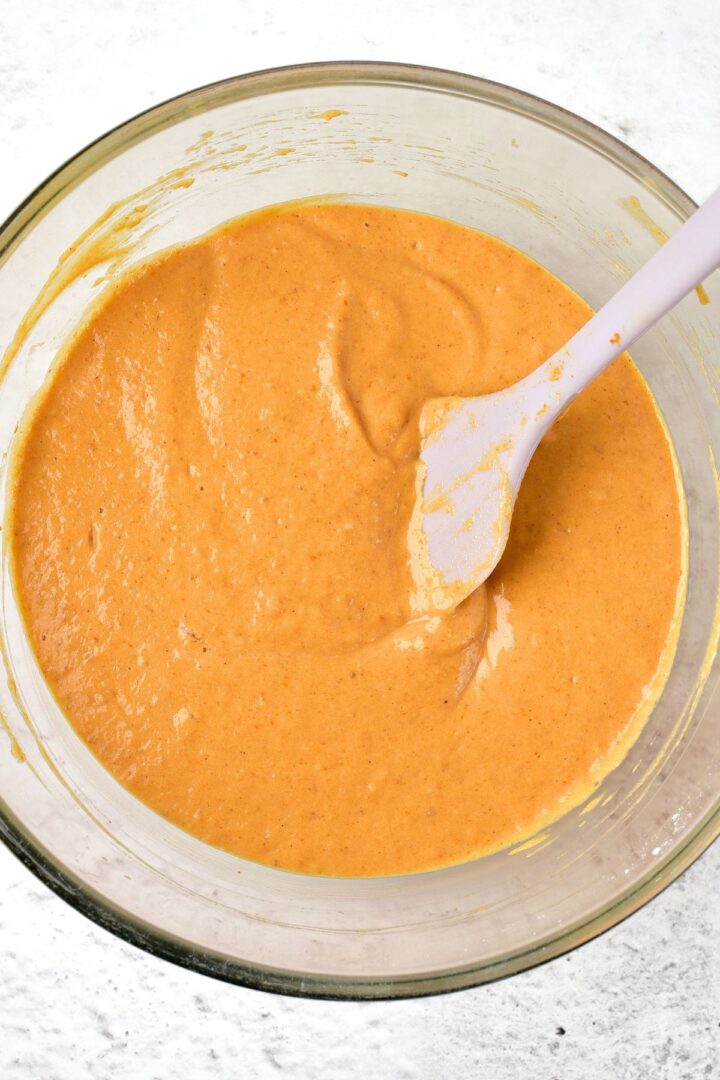 Mixing gluten-free pumpkin batter in glass bowl