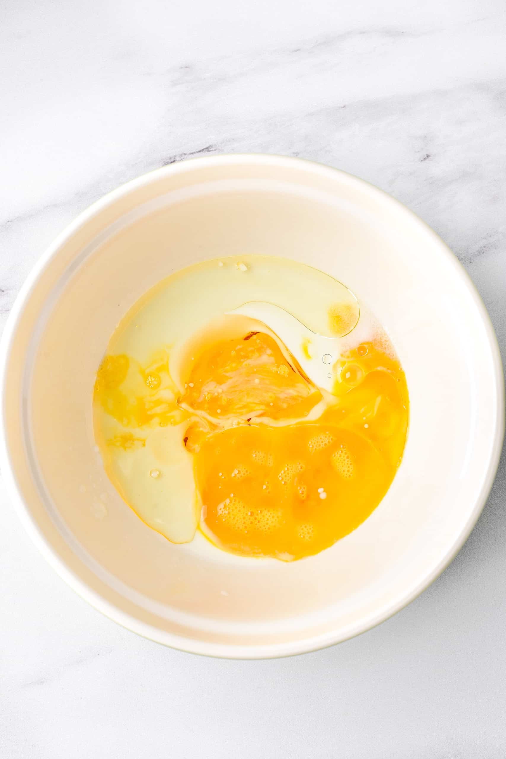 Egg mixture in white bowl.