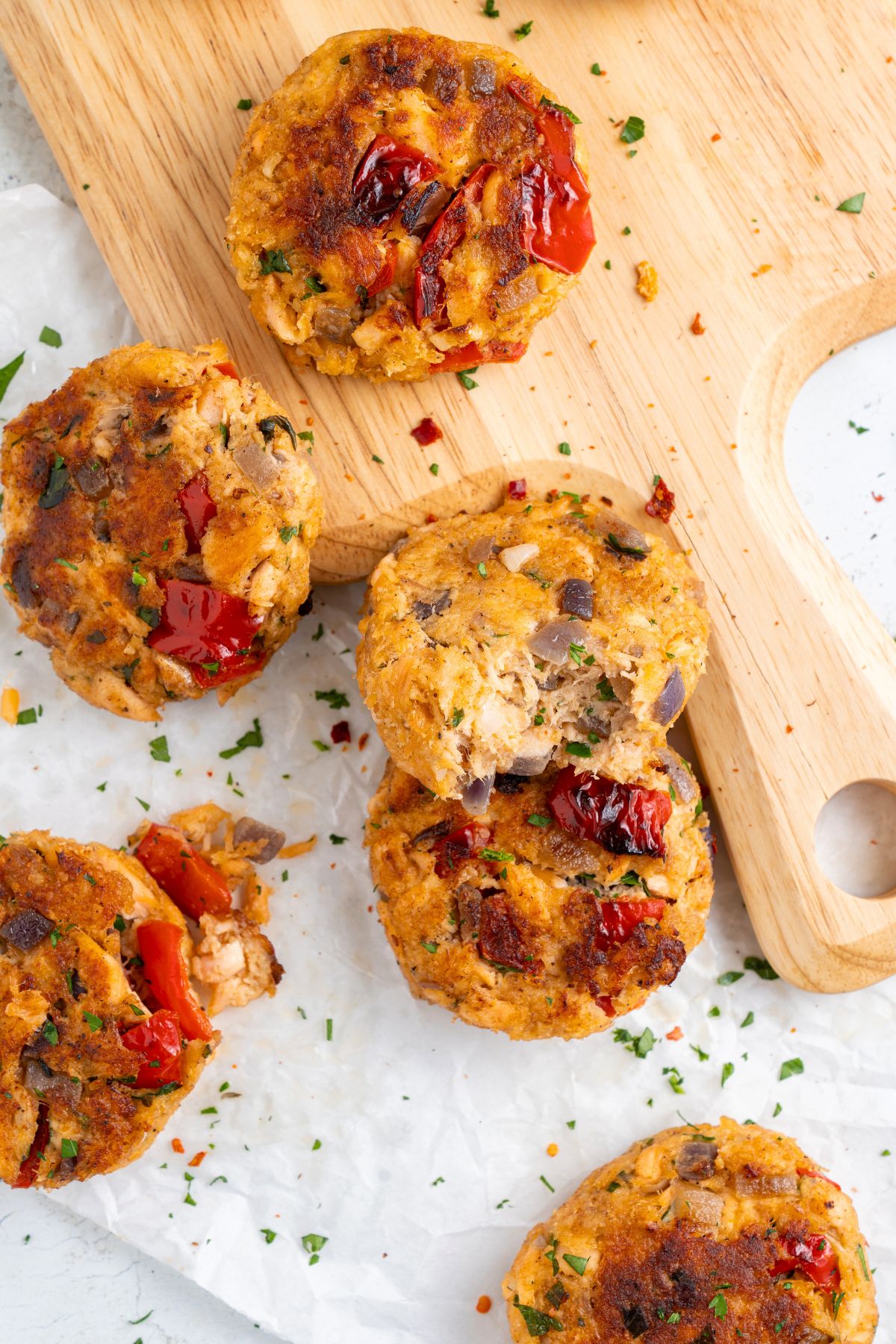 Top down view of easy salmon patties  (gluten-free) on wooden board.
