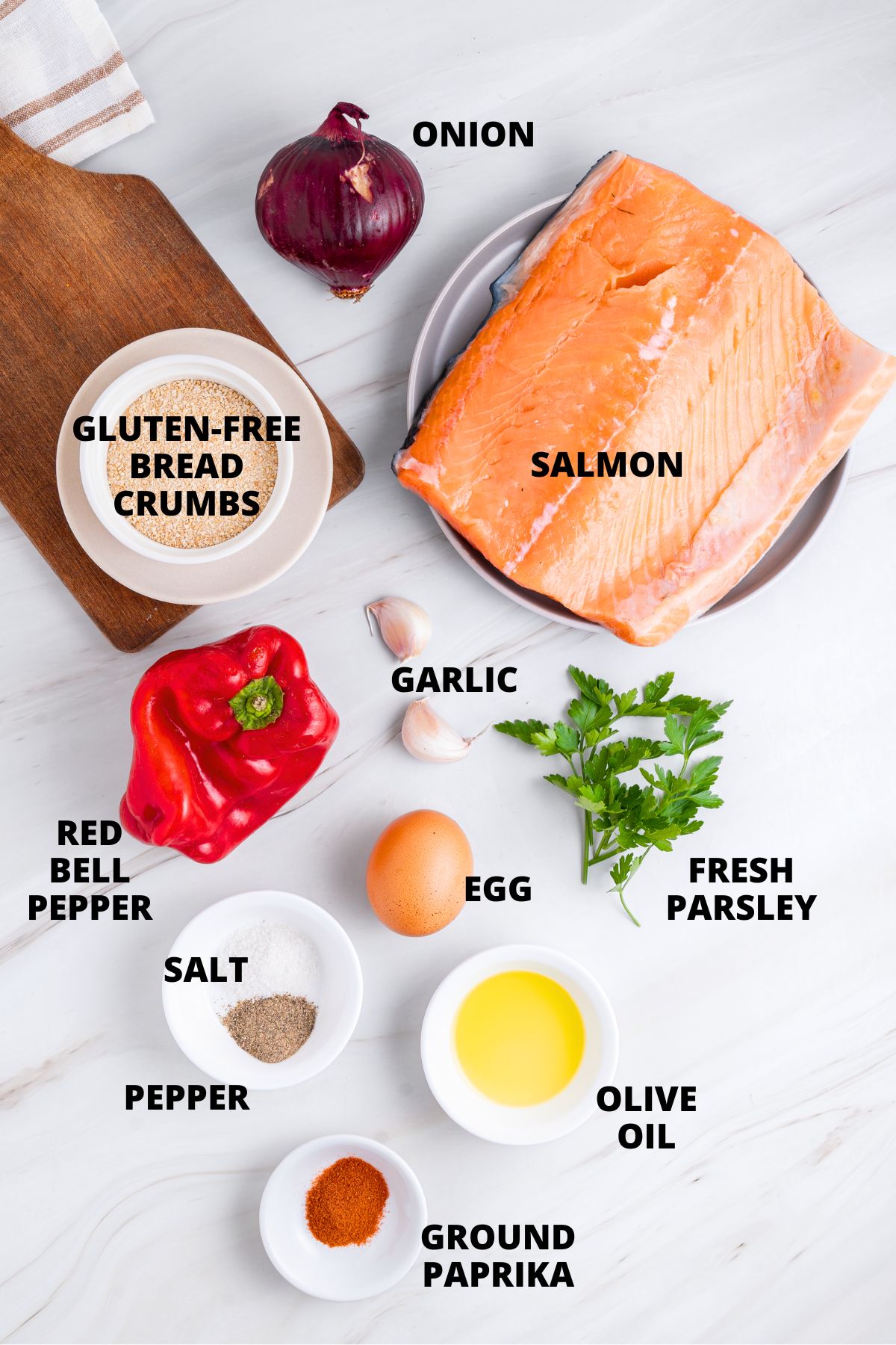 Ingredients for gluten-free salmon patties recipe laid out on marble board.