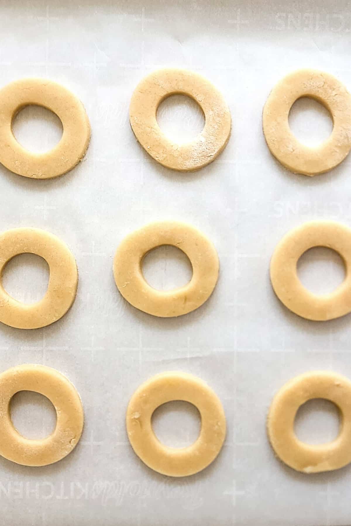Cut out dough circles on parchment paper.