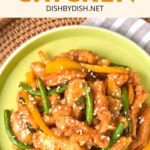 Top down view of a honey sesame chicken on green plate.