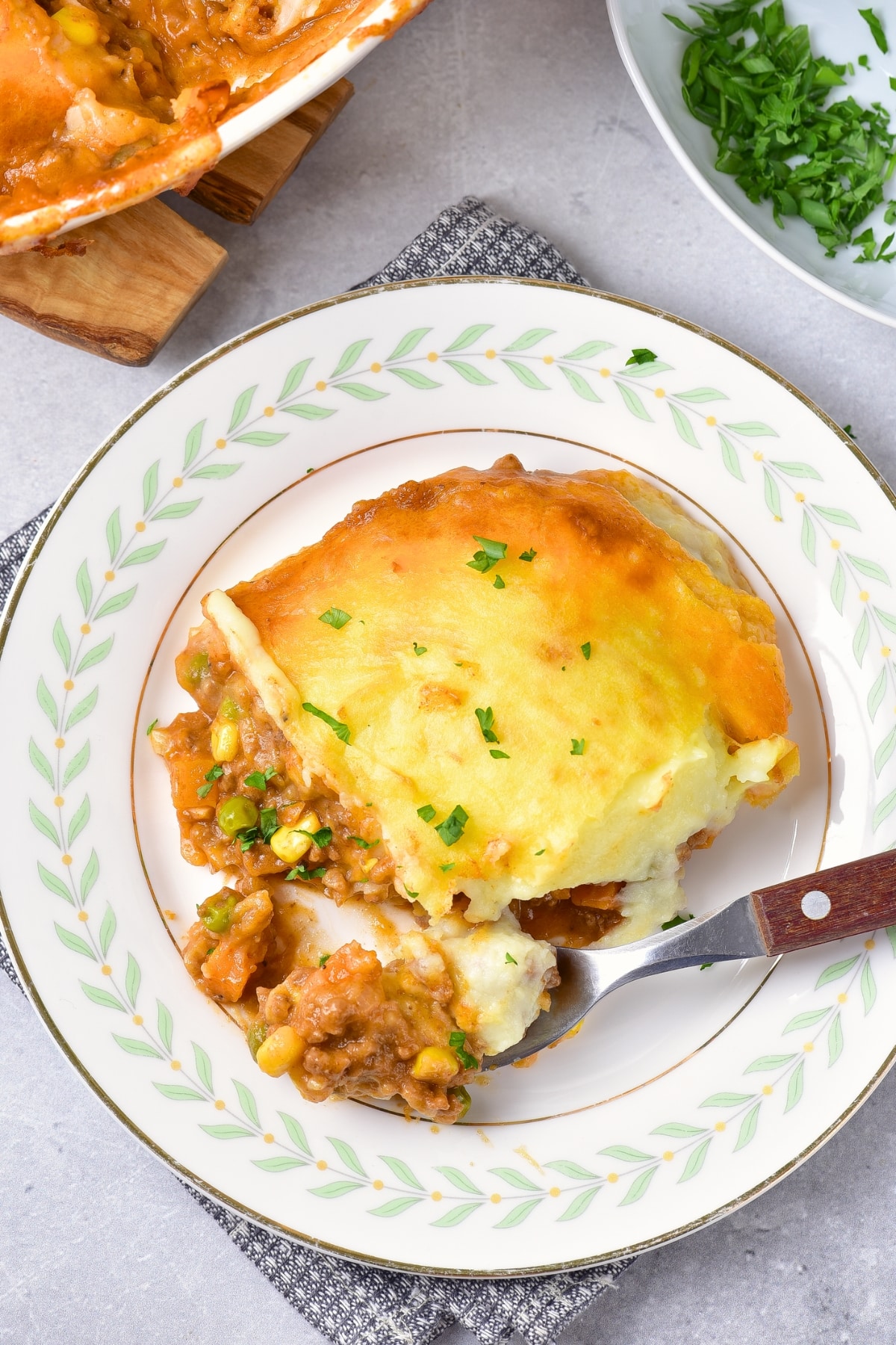 Top down view of a portion of gluten-free shepherd's pie on plate.