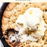 Half-eaten skillet cookie topped with ice cream