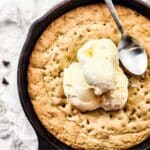 Top down view of scoops of ice cream on top of gluten-free skillet cookie.