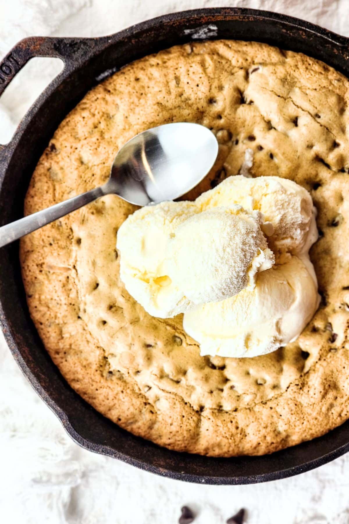 Top down view of gluten-free skillet cookie topped with ice cream.