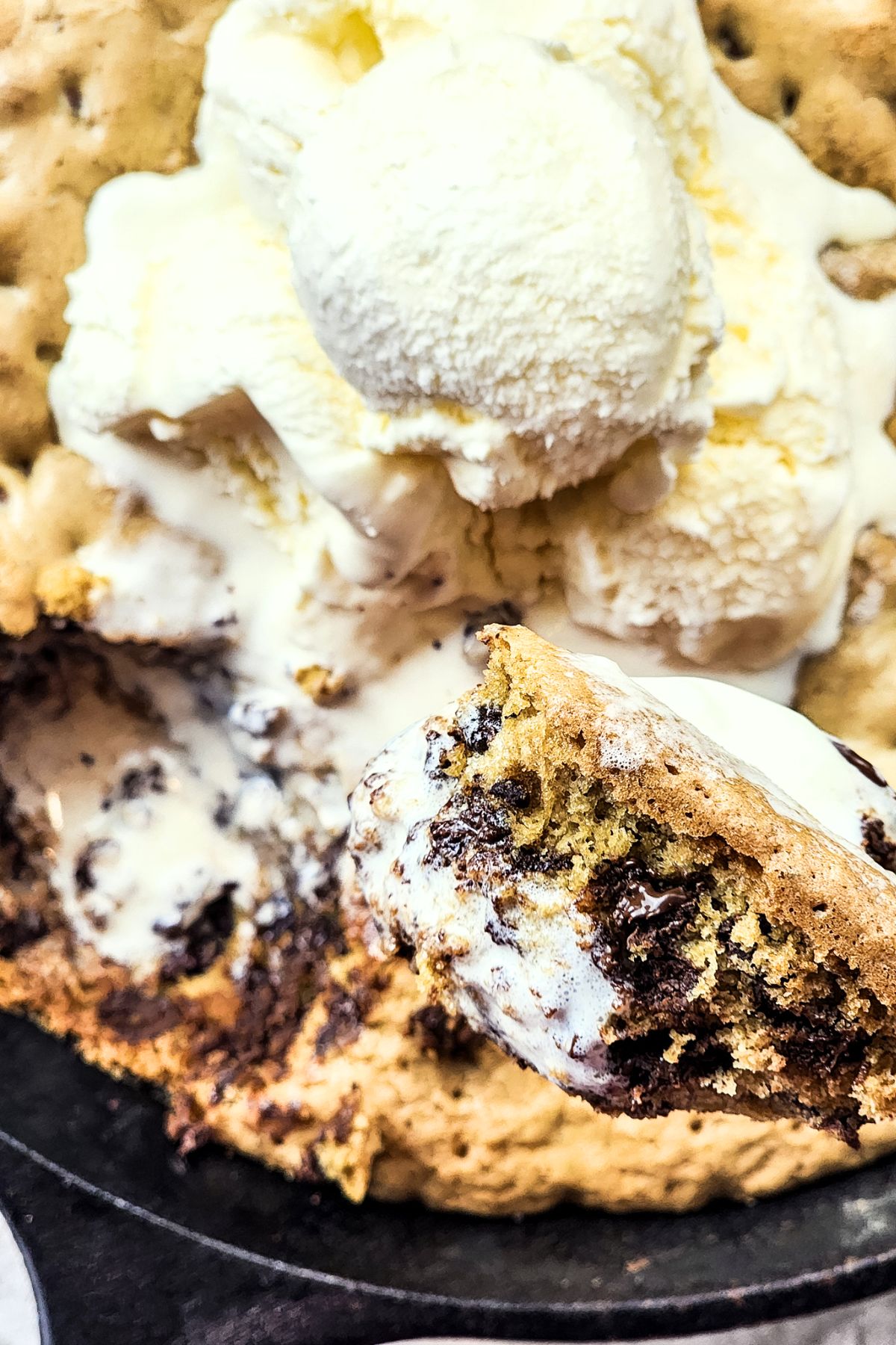 Holding up a spoonful of skillet cookie.