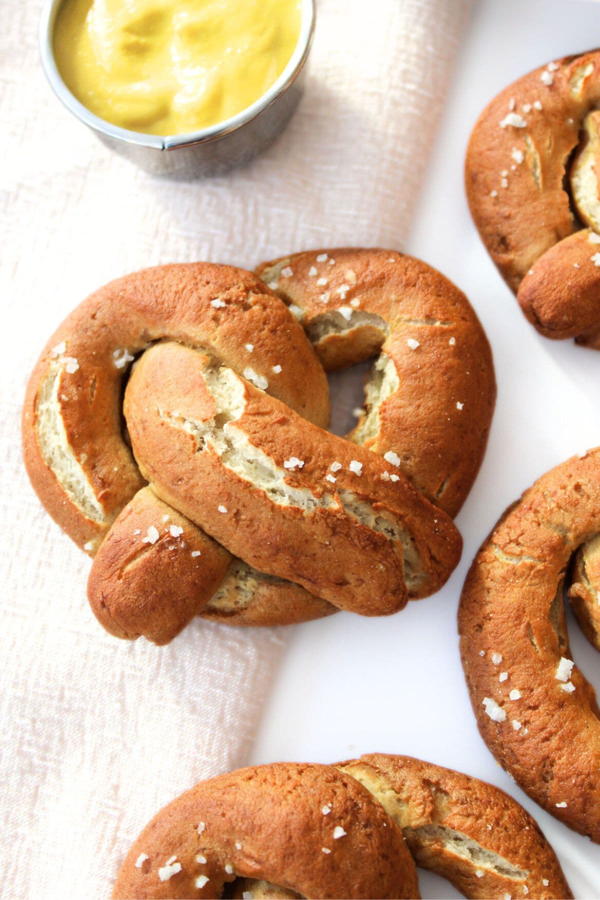 GF soft pretzels and mustard on table cloth