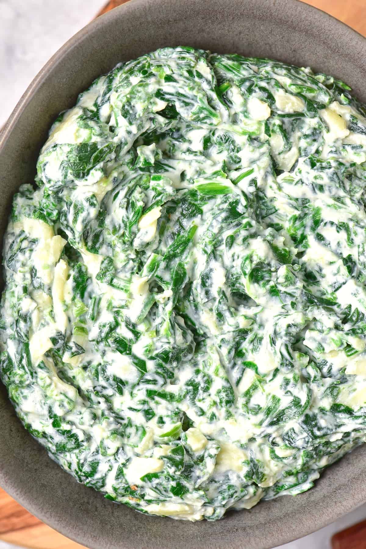 Up close shot of the texture of gluten-free spinach dip.