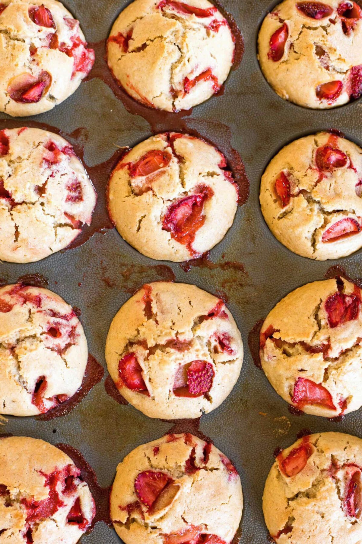 Freshly baked strawberry muffins in silicon mold.