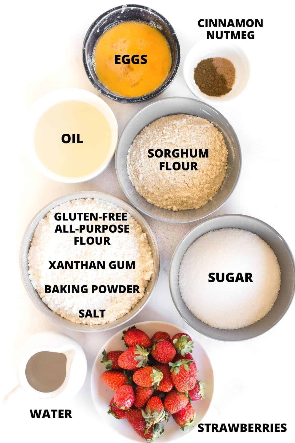 Ingredients for gluten-free strawberry muffins recipe laid out on marble board.