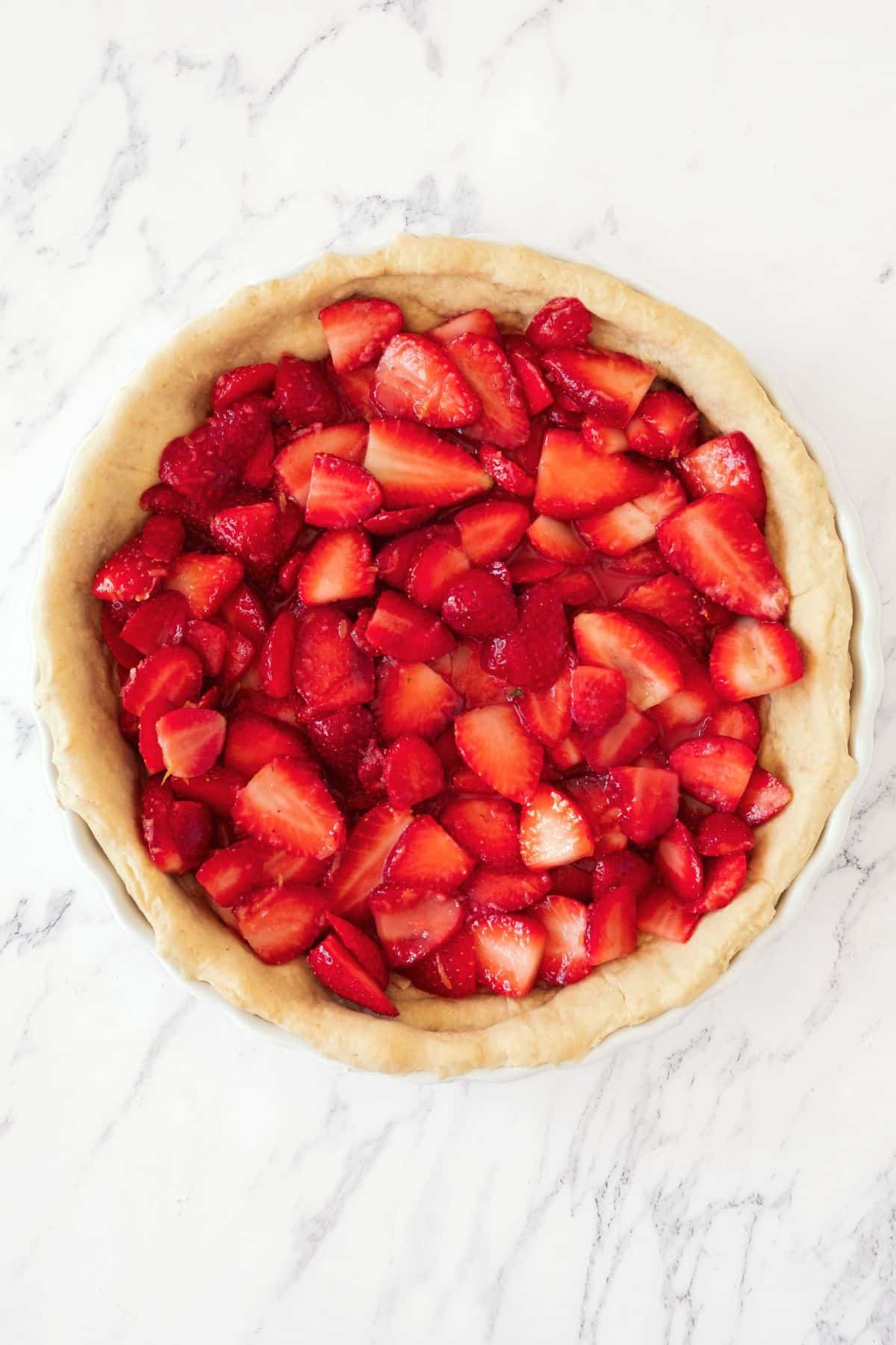 Fresh strawberries in par-baked pie dough