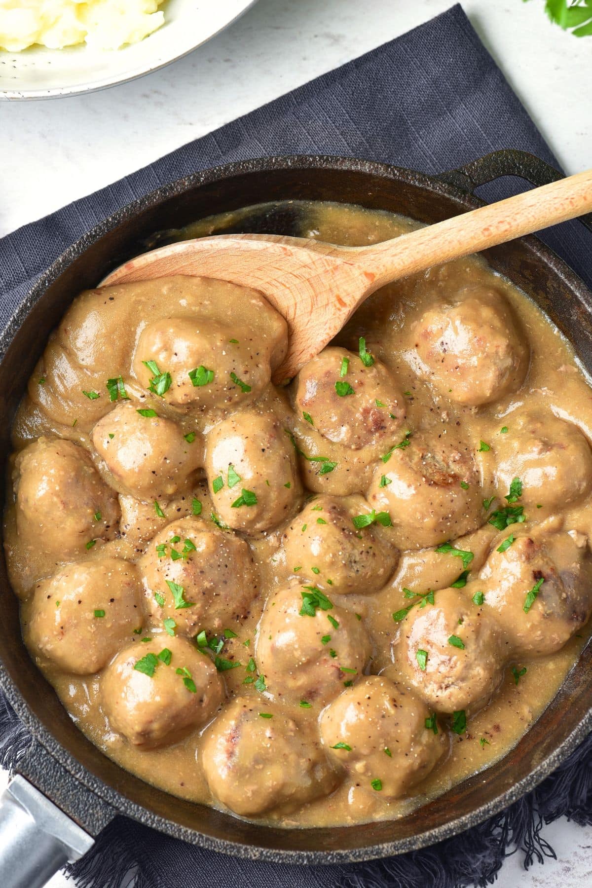Top down view of a skillet with Swedish meatballs (gluten-free).