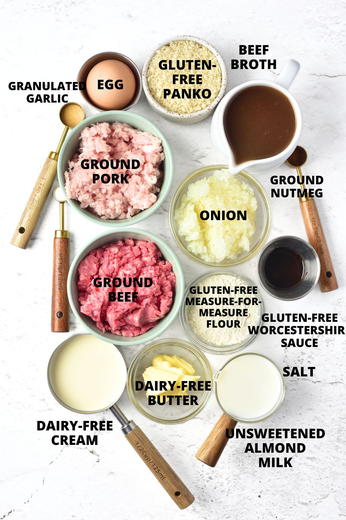 Ingredients for gluten-free Swedish meatballs recipe laid out on marble board.