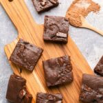 Top down view of brownies on wooden board.