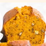 Up close view of a half-sliced sweet potato loaf