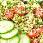 A bowl of gluten-free tabbouleh topped with cucumber slices