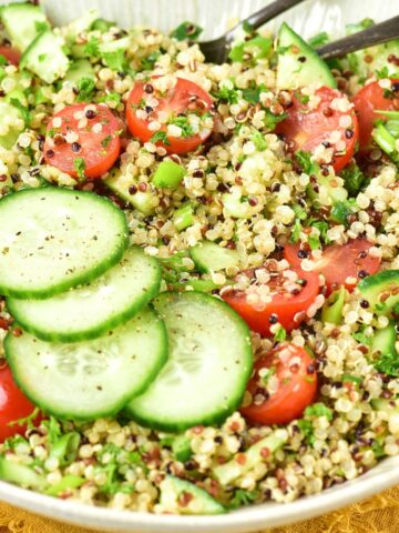Up close view of a bowl of gluten-free tabbouleh (quinoa tabbouleh salad).