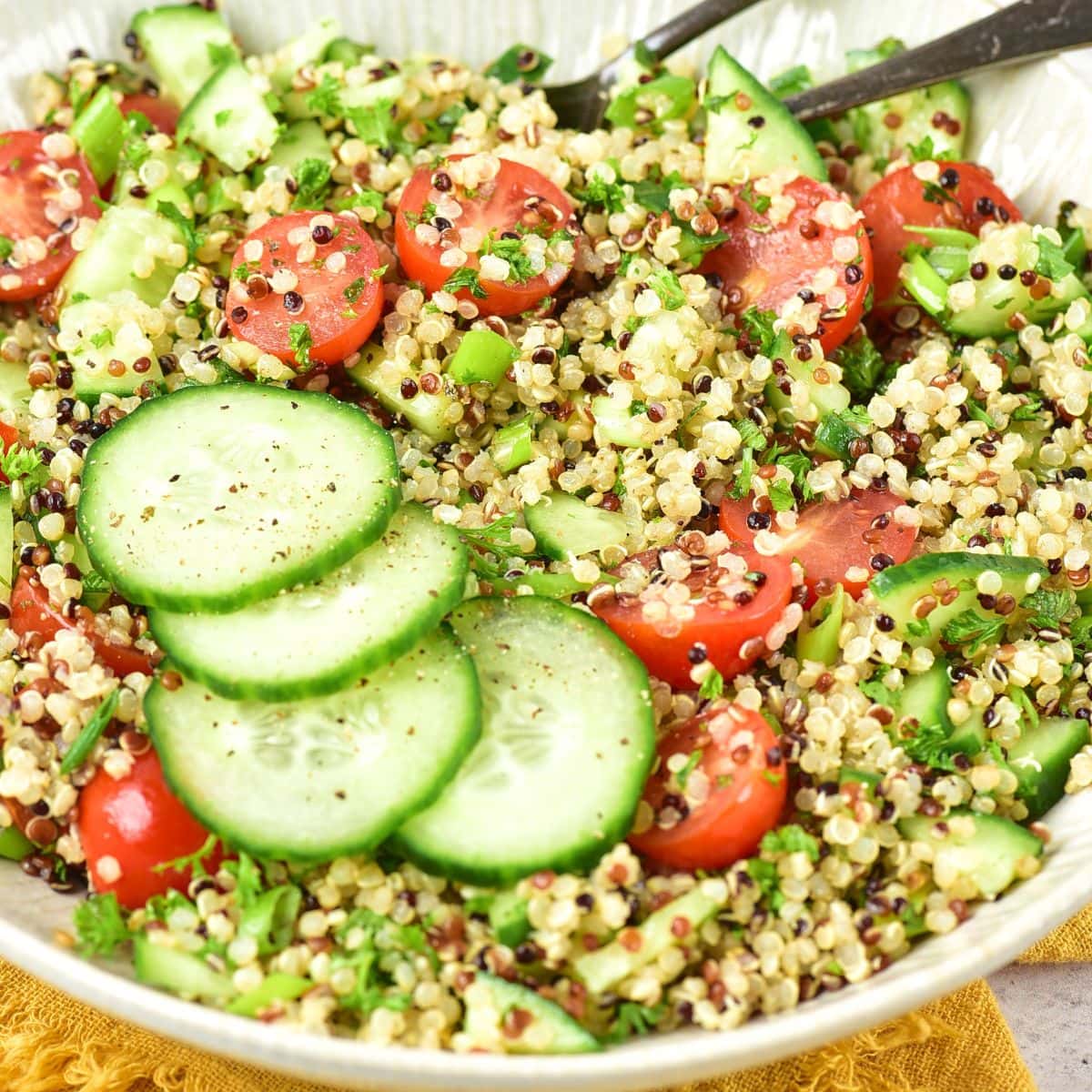 Up close view of a bowl of gluten-free tabbouleh (quinoa tabbouleh salad).