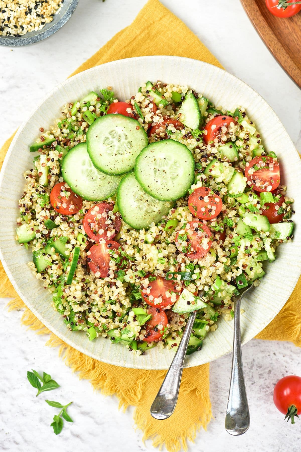 Gluten-Free Tabbouleh (Quinoa Tabbouleh Salad) Top down view of a bowl of gluten-free tabbouleh (quinoa tabbouleh salad).
