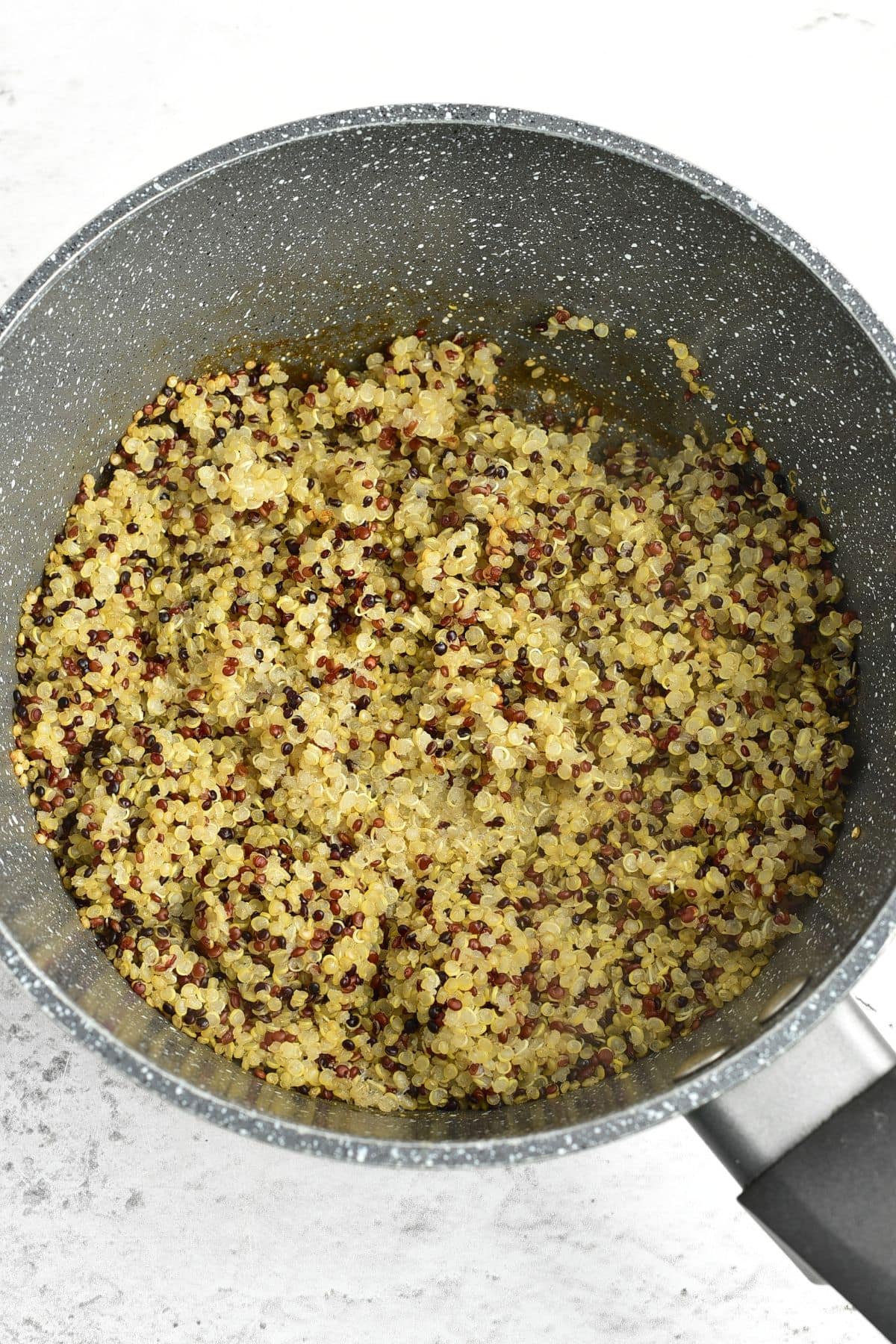 How to Make Quinoa Cooked tri-color quinoa in a saucepan