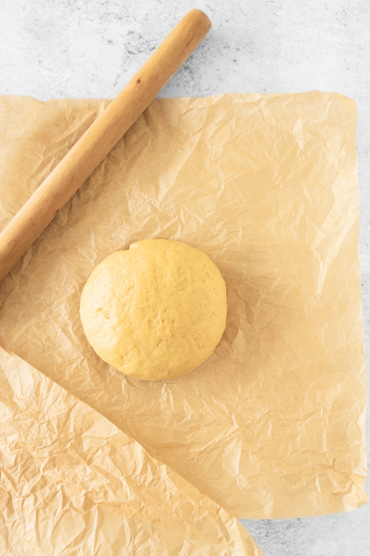 A dough ball on parchment paper