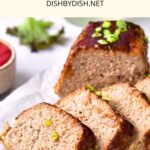 Sliced meatloaf on parchment paper.
