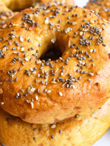 A stack of gluten-free everything bagels