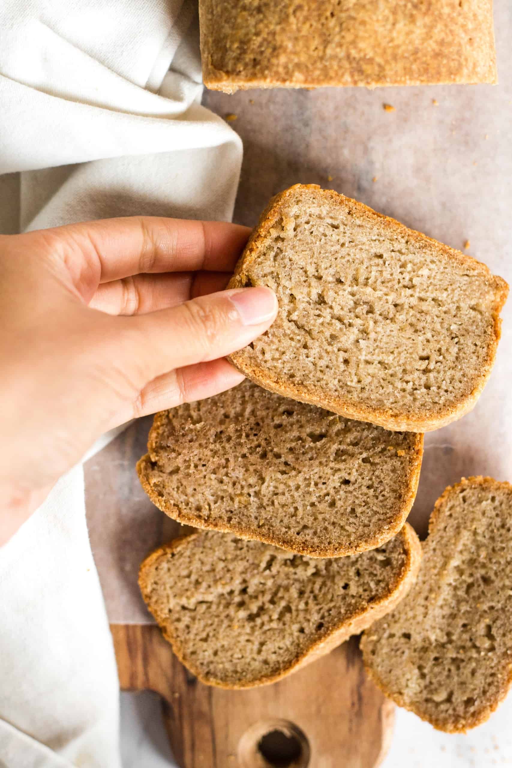 Reaching for a slice of gluten-free whole grain bread.