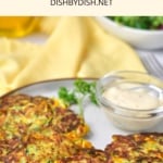 A plate of gluten-free zucchini fritters with tartar sauce.